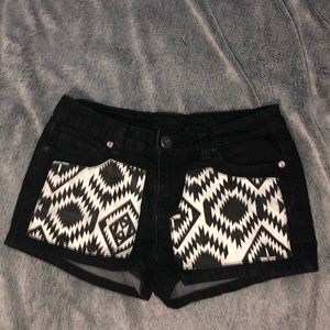 Black shorts with Aztec printed pockets